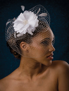 Basic fly Away Birdcage with Large flower with Pearl Stamens and Stripped Coque Feathers.