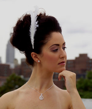 Double large feather comb with coque  feathers, Swarovski crystals and pearl accent.
