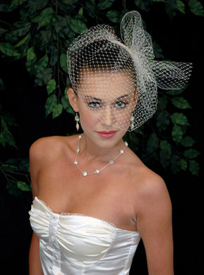 Basic Blusher Birdcage Veil with Birdcage pouf netting with hand beaded knotted and draped pearl accent.