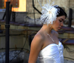 Curly Ostrich cluster with vintage style broche