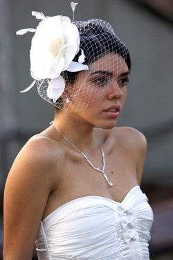 Large Silk and Organza flower with leaves ,Coque Feathers and Fly Away Birdcage Veil.
