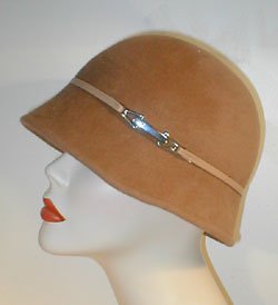 Velour Asymmetrical Cloche with Cream Lambskin Leather Band and Silver Accented Buckle.